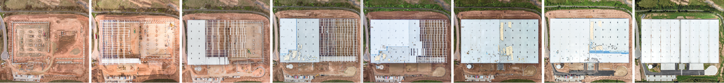 Blick auf den Baufortschritt mehrerer Lagerhallen aus der Vogelperspektive, verschiedene Bauphasen sichtbar.
