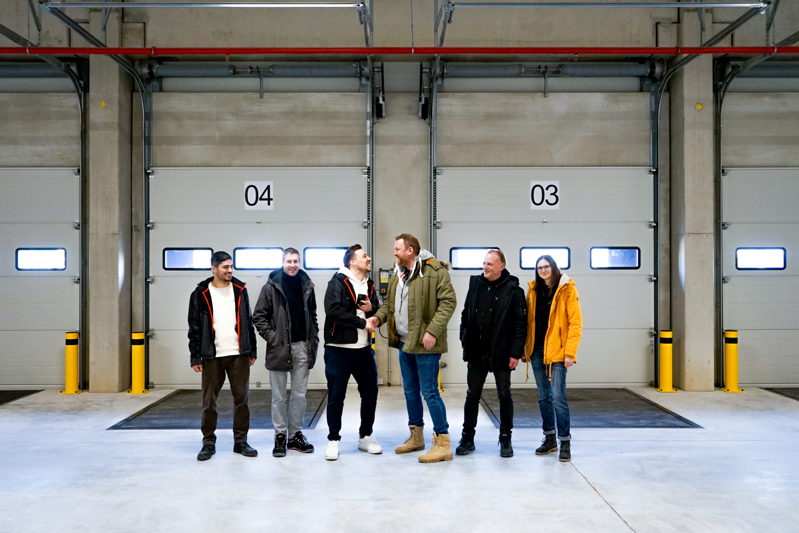Logistics hall fabrikon in Berlin Herzfelde, group photo at the successful handover of the keys.
